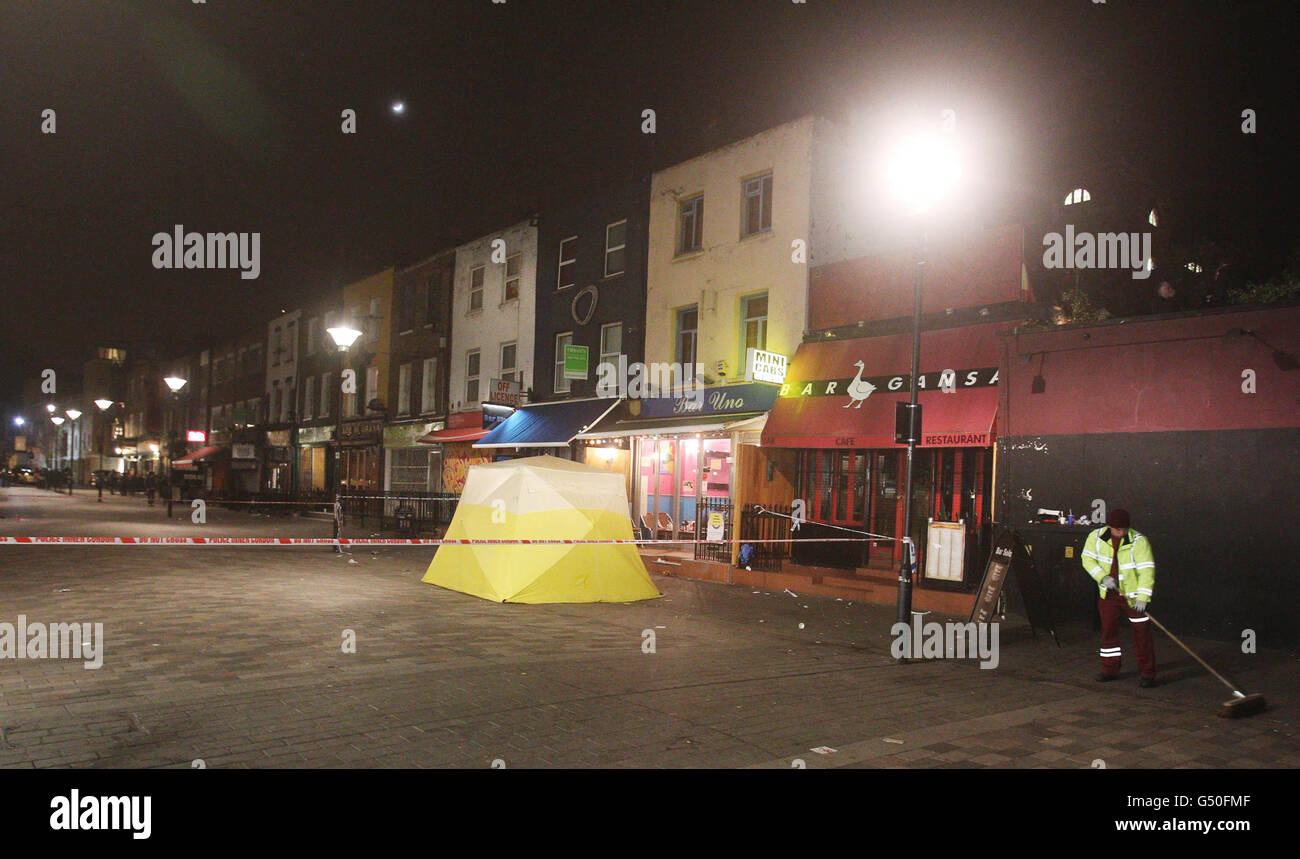 Police cordon outside Bar Uno in Camden, north London after a man was stabbed to death in a bar brawl. Stock Photo