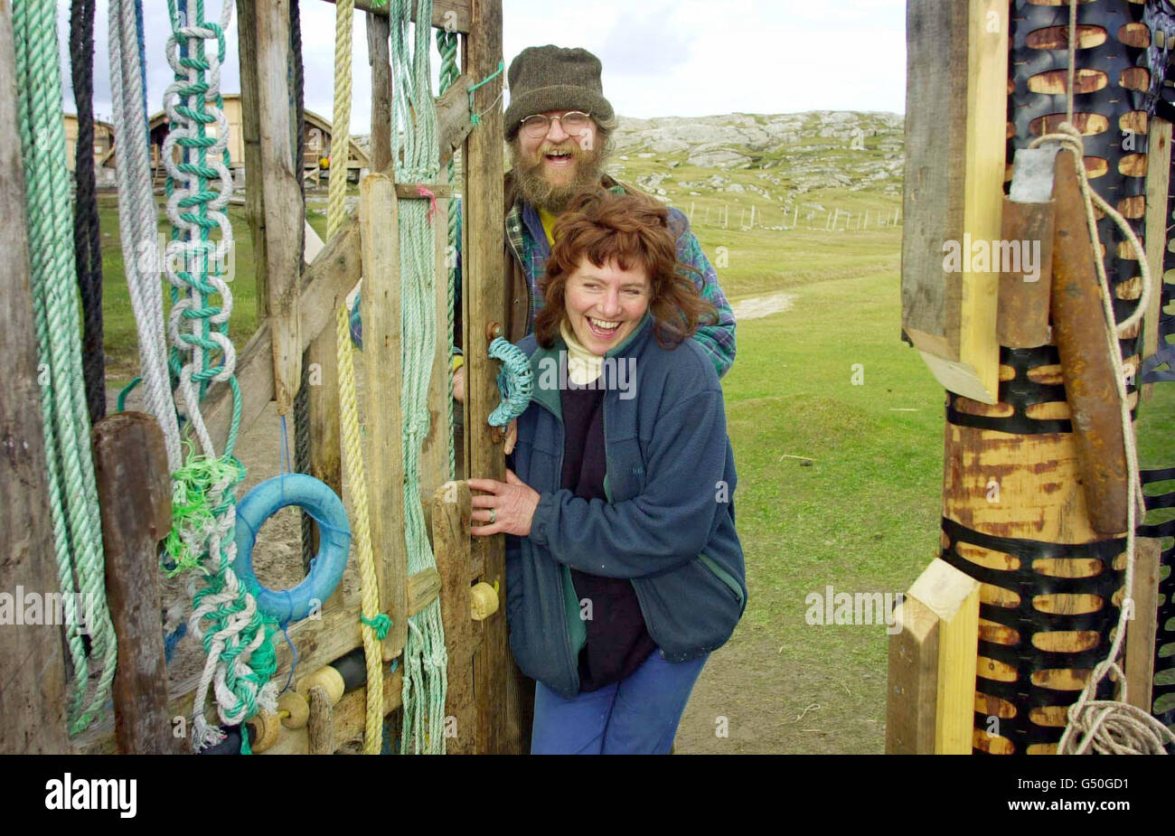 Peter Jowers and Hilary Freeman open the gate they built from items washed onto the beach, on the island of Taransay in the Western Isles of Scotland, where the group has been living since New Year's Eve as part of the BBC's Castaway 2000 programme. *07/09/2000 a seventh participant (Hiiary Freeman) has quit the program after feeling homesick for her family the BBC confirmed. Stock Photo