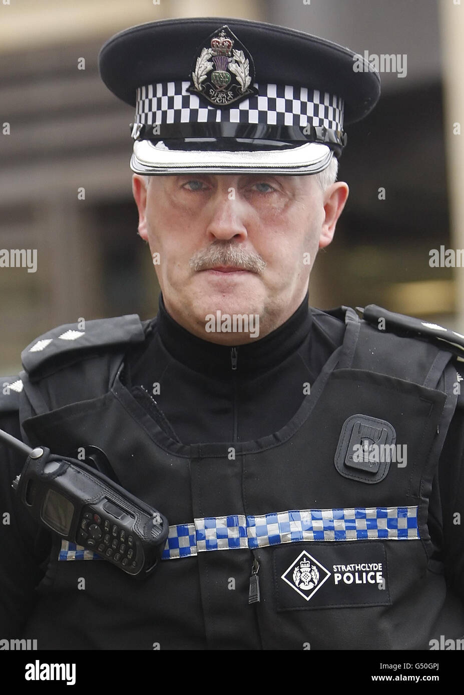 Inspector Brian Ferguson leaves Glasgow High Court in Scotland after