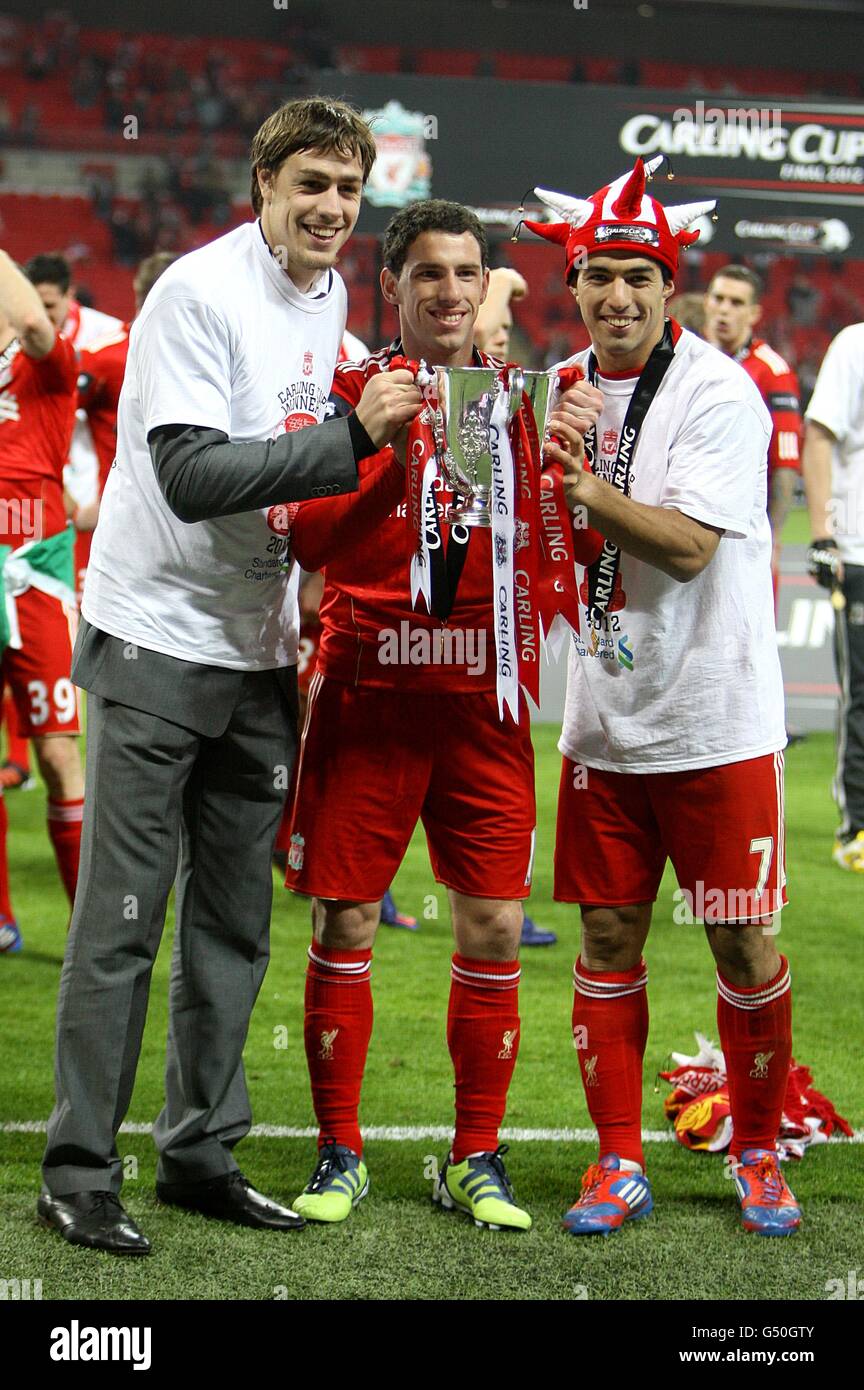 Liverpool's Sebastian Coates (left), Luis Suarez (right) and Rodriguez Maxi celebrate after the game Stock Photo