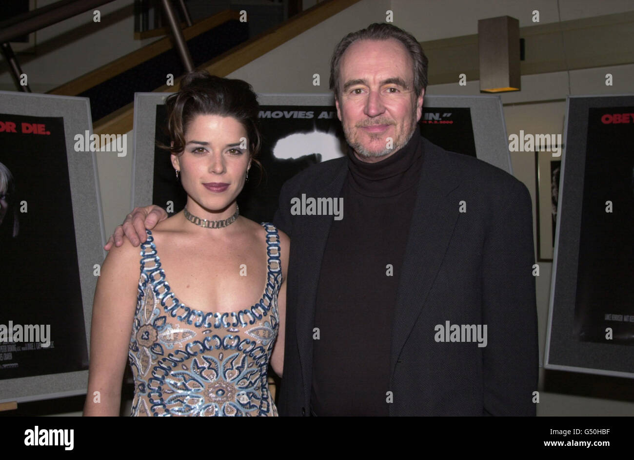 American actress Neve Campbell and driector Wes Craven arriving for the UK Celebrity Screening of 'Scream 3' in London. Stock Photo