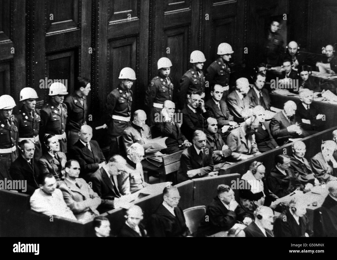 NUREMBERG TRIALS 1945: A general view of the former Nazi leaders of Germany during the Nuremberg trials which began at the Palace of Justice on 20/11/45. American military policemen watch over the two rows of defendants which include Goering, Hess, Keitel, Speer and Jodl. Second World War Stock Photo