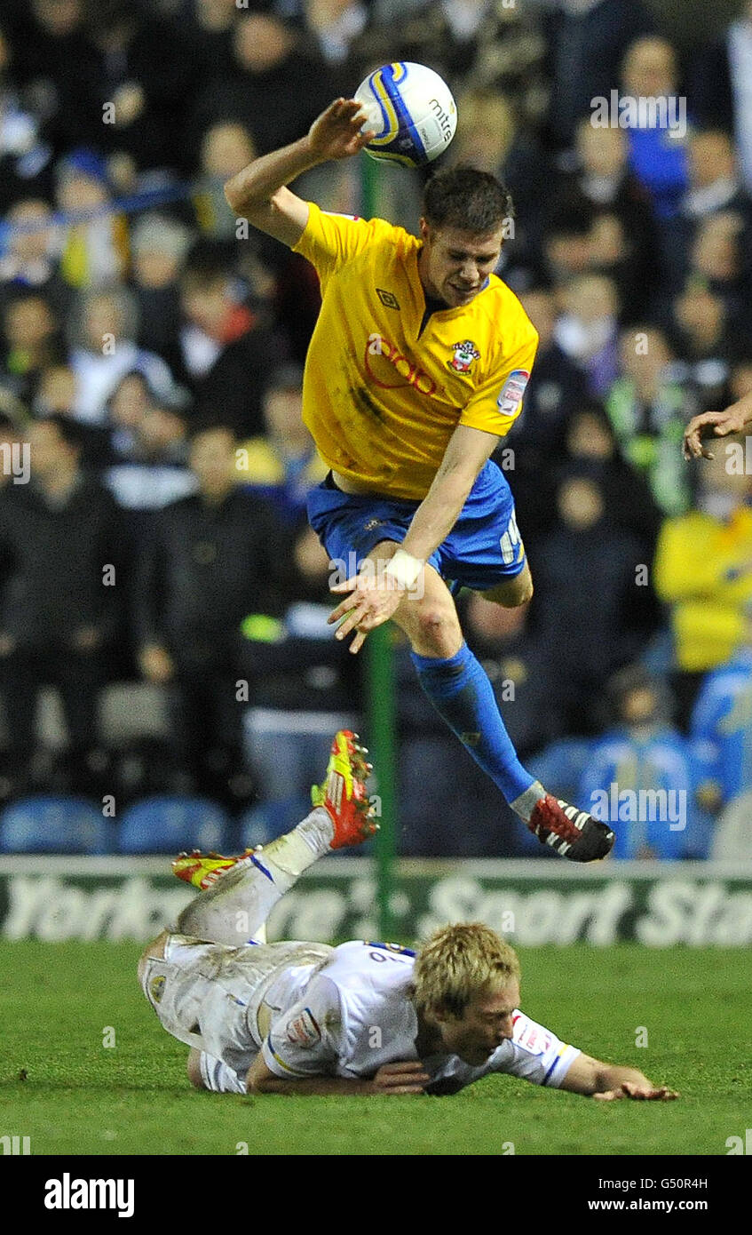 Leeds United's Luciano Becchio and Southampton's Dean Hammond (top) battle for the ball during the npower Football League Championship match at Elland Road, Leeds. Stock Photo