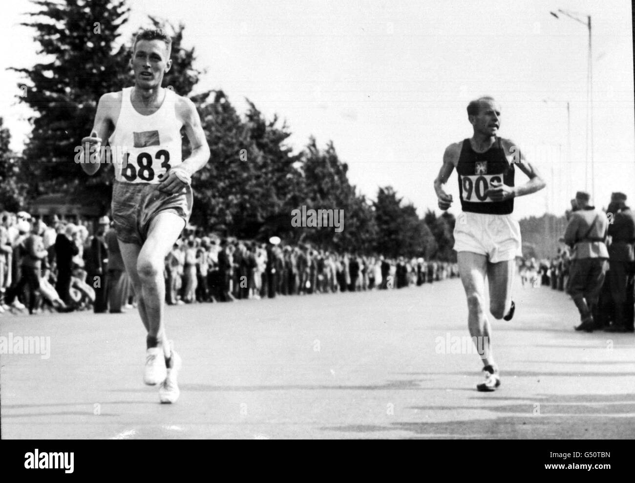 Czech athlete Emil Zatopek on his way to winning the Marathon event, at the 1952 Olympic Games, held in Helsinki, Stock Photo -