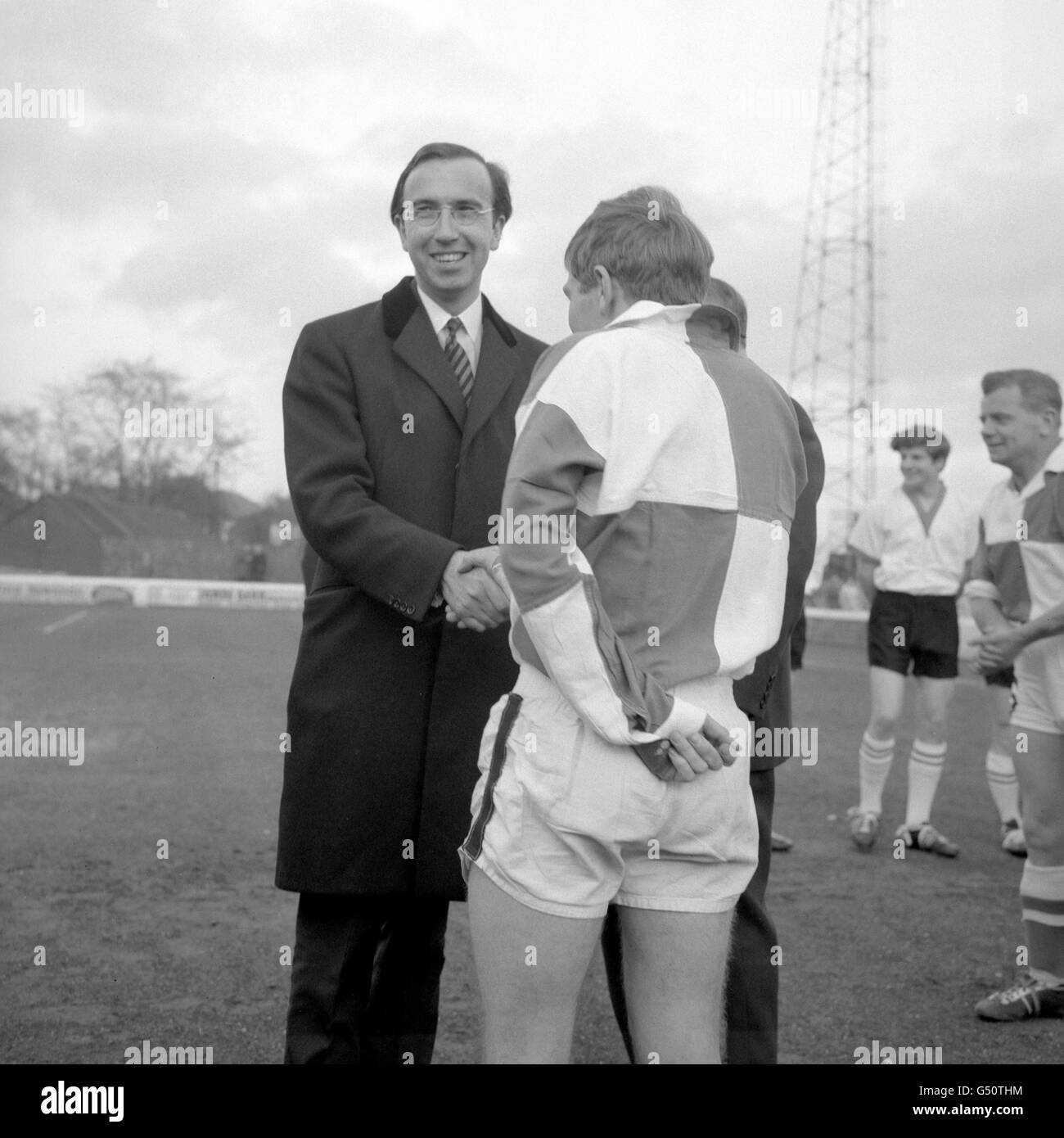 MP for Chelmsford, Norman St. John Stevas, shakes hands with members of the Chelmsford Prison football team, before the Chelmsford and Mid-Essex Football Combination Division II Cup Final at Chelmsford City Football Ground. Stock Photo