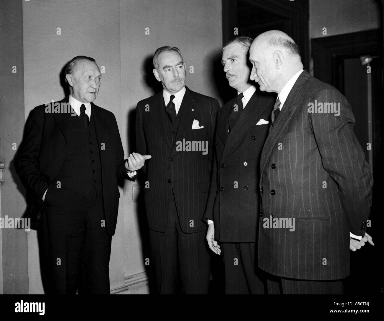 L-R: Dr Konrad Adenauer, Federal German Chancellor; Dean Acheson, American Secretary of State; Anthony Eden, British Foreign Secretary, and Robert Schuman, French Foreign Minister at Downing St, London, for a meeting regarding the future of European defence. Stock Photo