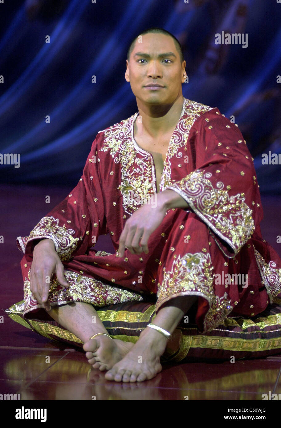 American actor Jason Scott Lee sitting on a pillow, during rehearsals for the stage musical of 'The King And I', currently previewing at the London Palladium, Argyll Street, London. Stock Photo