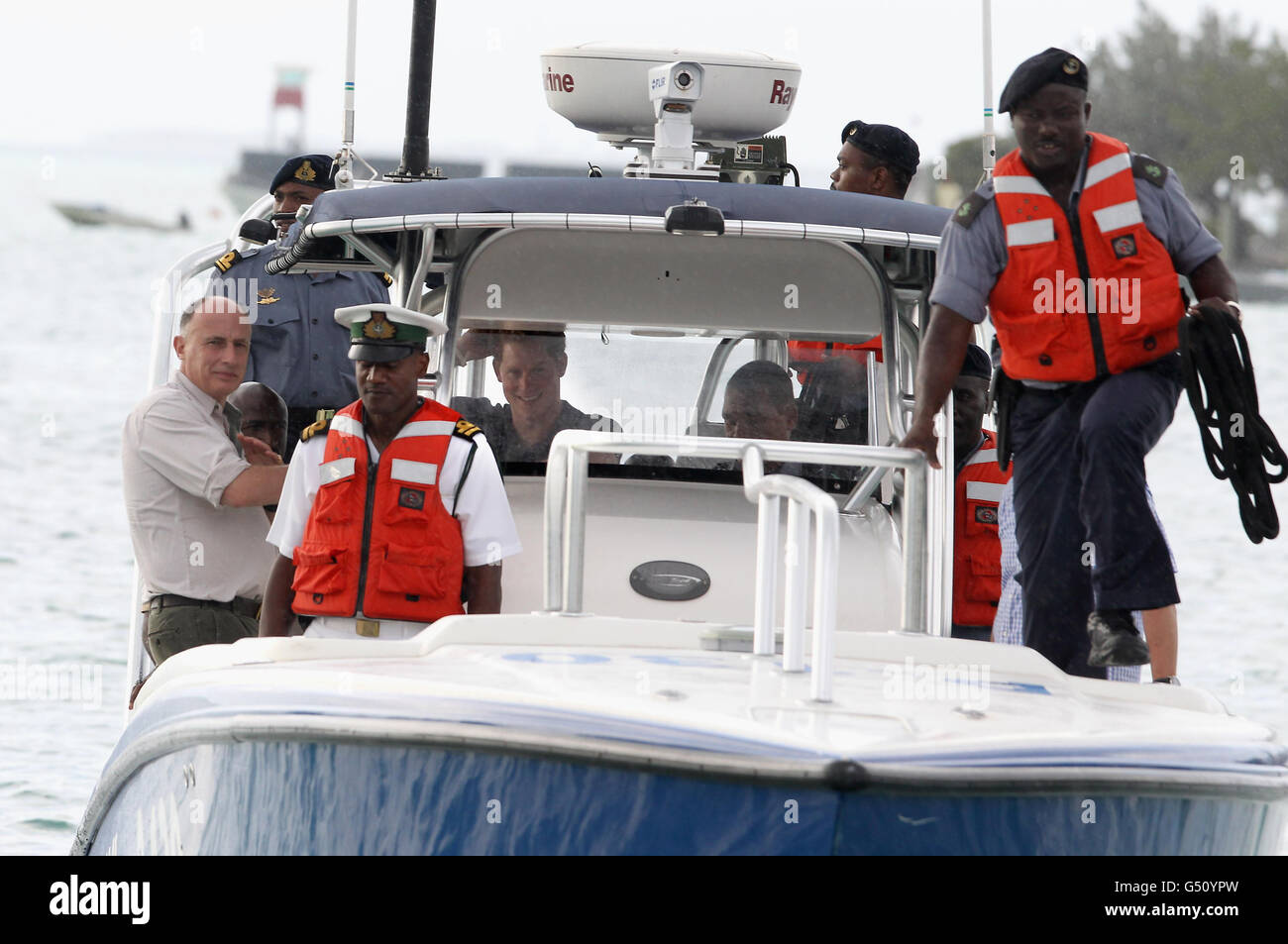 Prince harry arrives for visit to harbour island in nassau hires stock