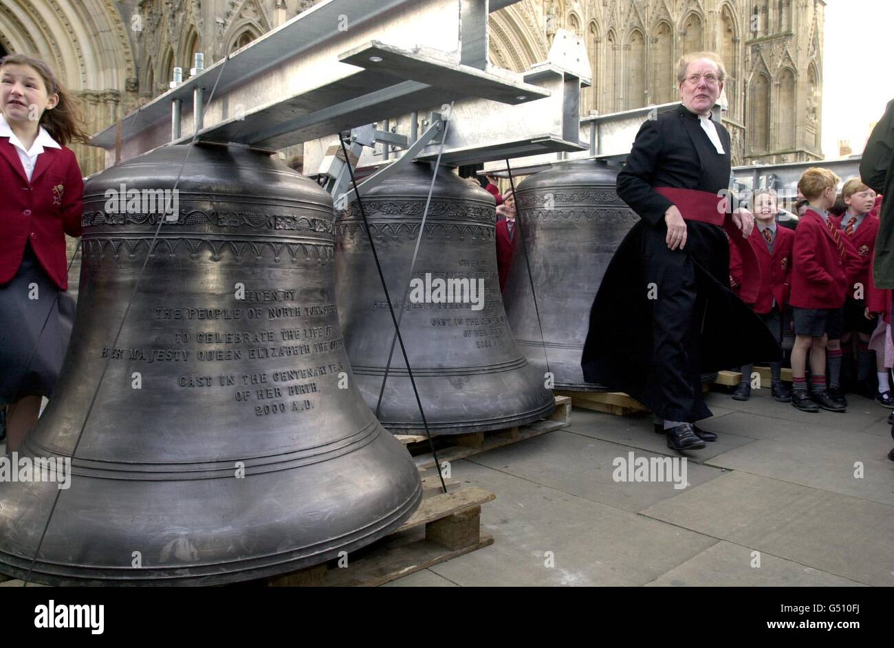 The Dean of York, the Very Revd Dr Raymond Furnell conducts a short service of dedication for the six new chiming bells to Commemorate the life of the Queen Mother in her Centenary year at York Minster, York where the bells were installed. Stock Photo