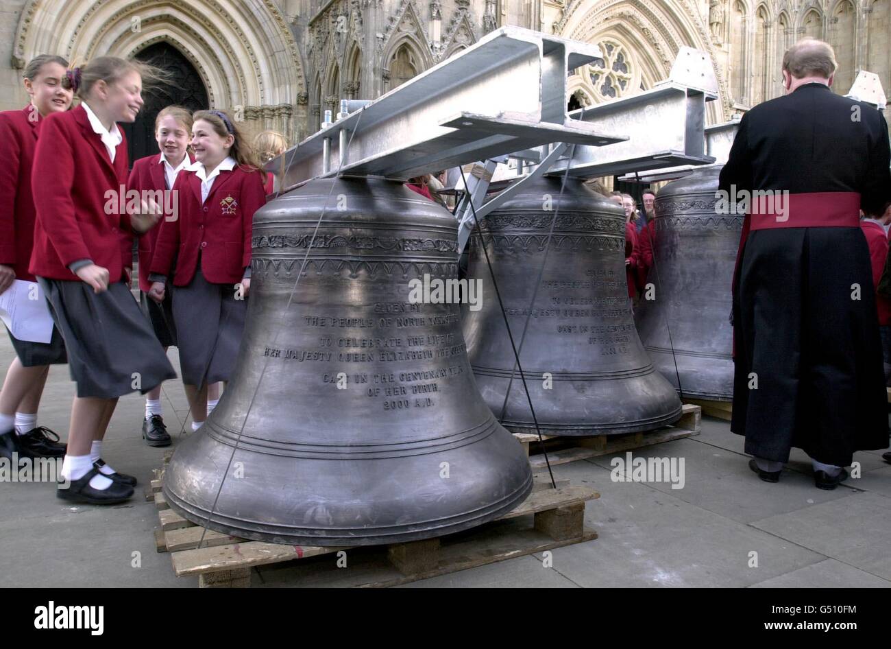 The Dean of York, the Very Revd Dr Raymond Furnell conducts a short service of dedication for the six new chiming bells to Commemorate the life of the Queen Mother in her Centenary year at York Minster, York where the bells were installed. Stock Photo