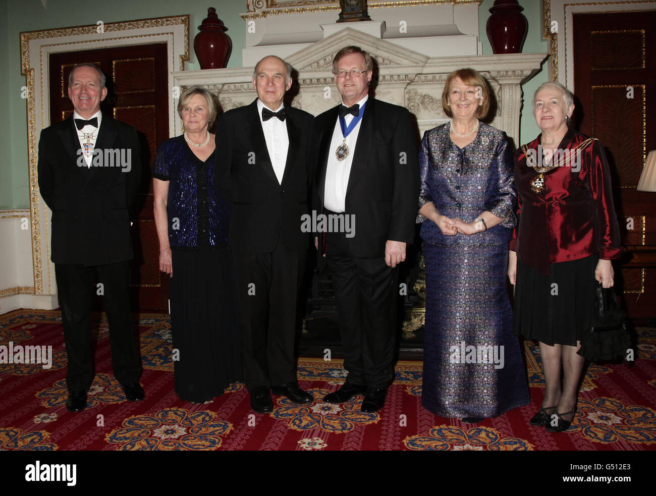 Sheriff Alderman Alan Jarrow (left), Business Secretary Vince Cable (third left) and his wife Rachel (second left), The Lord and Lady Mayor of the City of London, David Wootton (third right) and his wife Liz (second right), and Sheriff Wendy Mead (right). during the annual Trade and Industry Dinner, at Mansion House in the City of London. Stock Photo