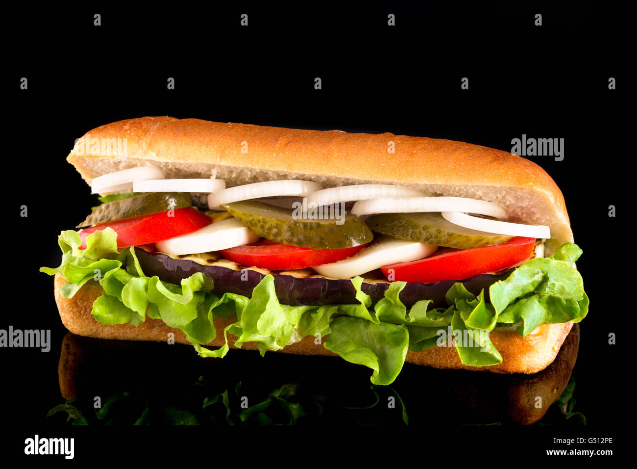 Sandwich with tehina, eggplant, boiled egg, tomato, pickled cucumber