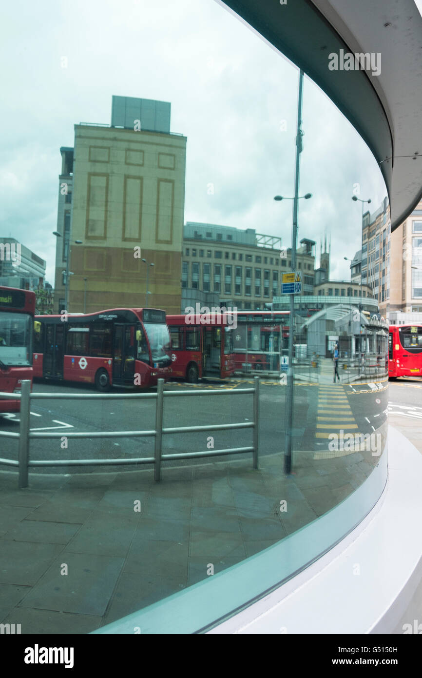 Reflections in a window at Hammersmith Bus Station, London, UK Stock