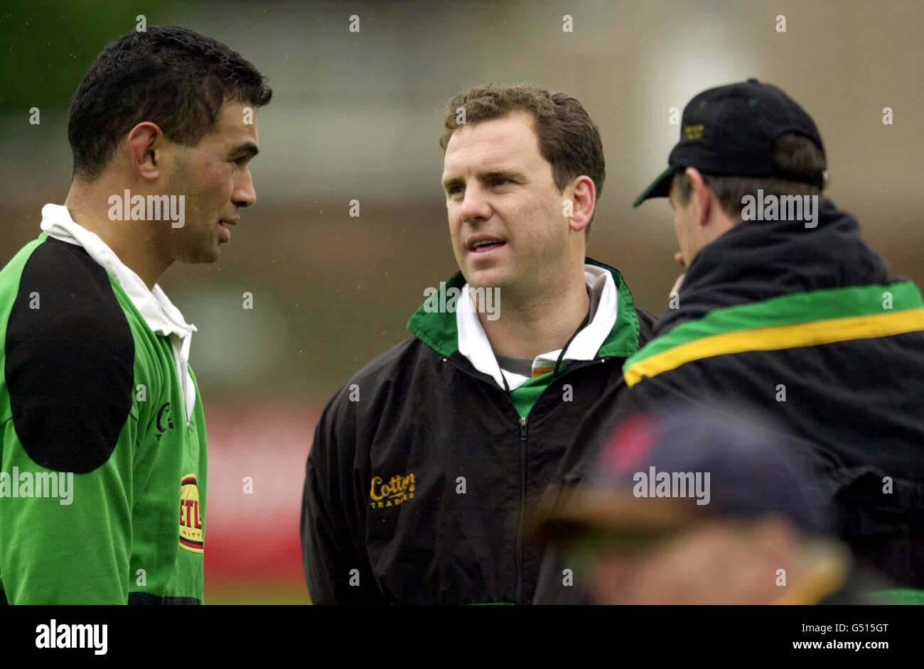 Northampton rugby union coach John Steele (centre) talks with Pat Lam
