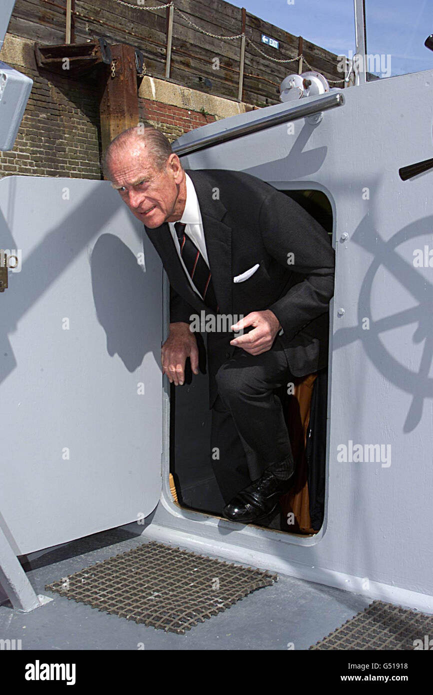 The Duke of Edinburgh passes through the hatchway on board MTB 102 L at Dover Harbour. The Duke was at Dover as The little ships of Dunkirk prepare to sail once more for the Northern coast of France, 60 years after they evacuated the British Expiditionary force. Stock Photo
