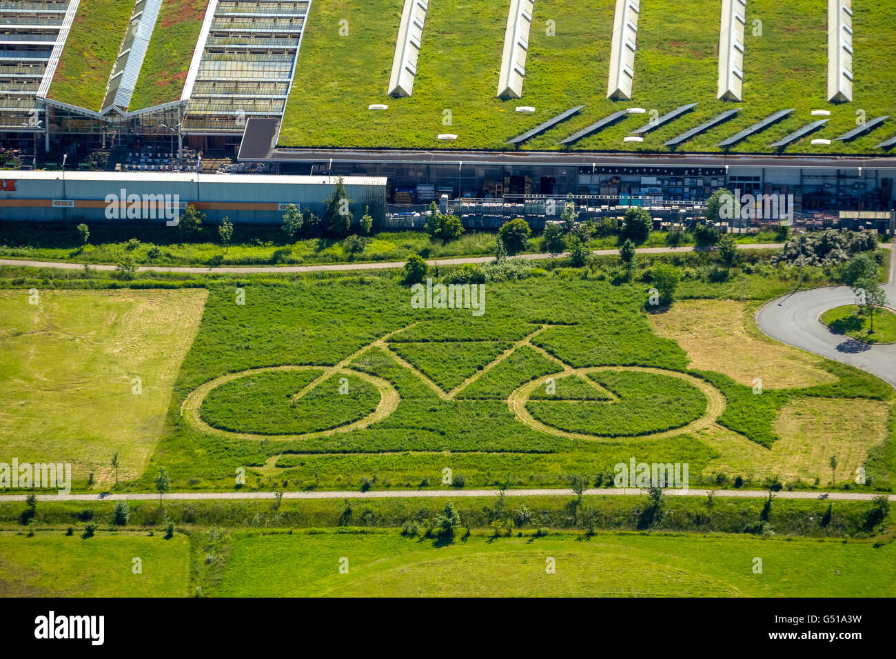 Aerial view, Ökozentrum Hamm, with a large mown bicycle behind OBI, lawn  art and advertising for a bike shop, Hamm,, Ruhr region Stock Photo - Alamy