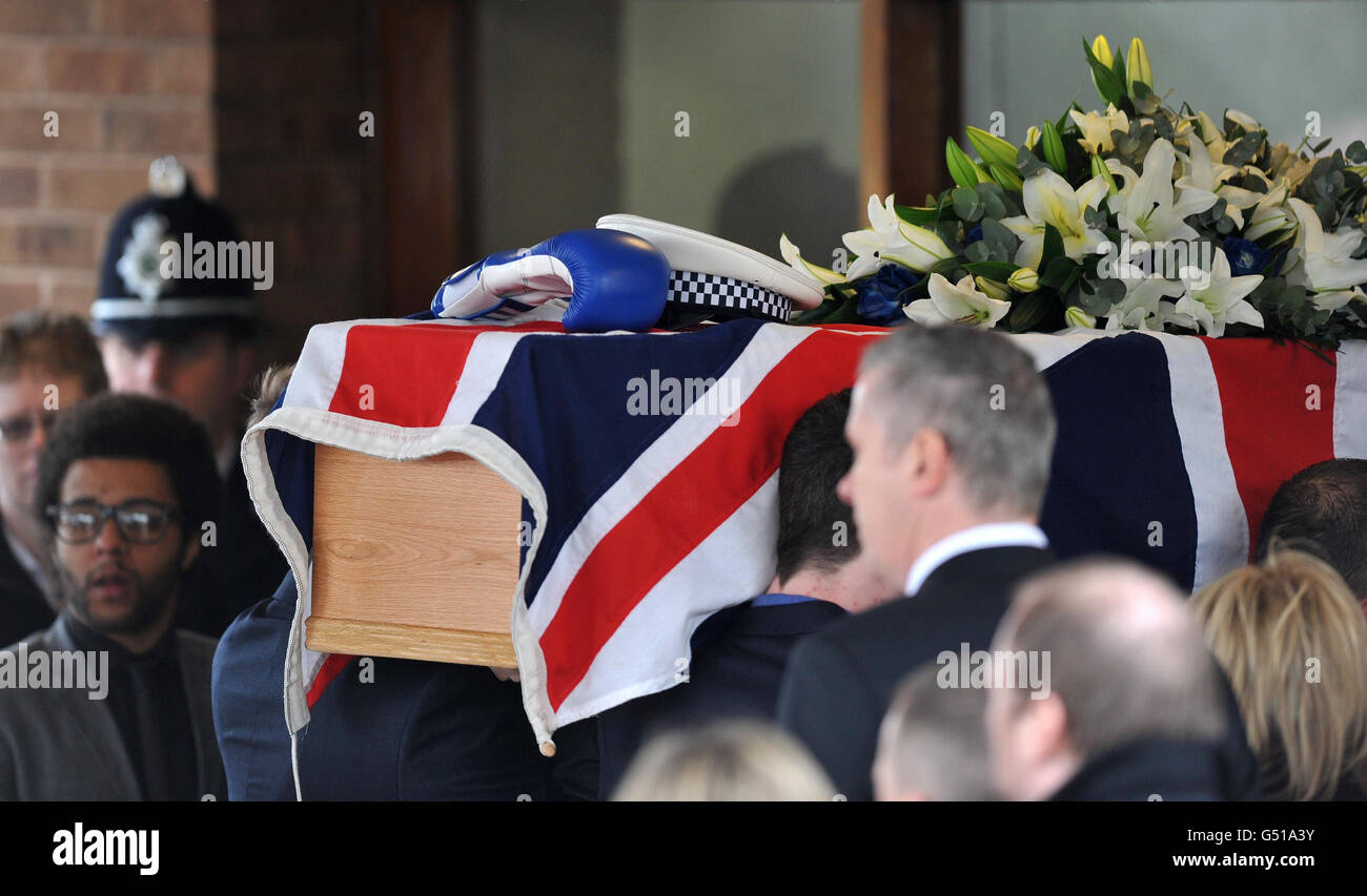The coffin of Pc David Rathband is carried into Stafford Crematorium at ...