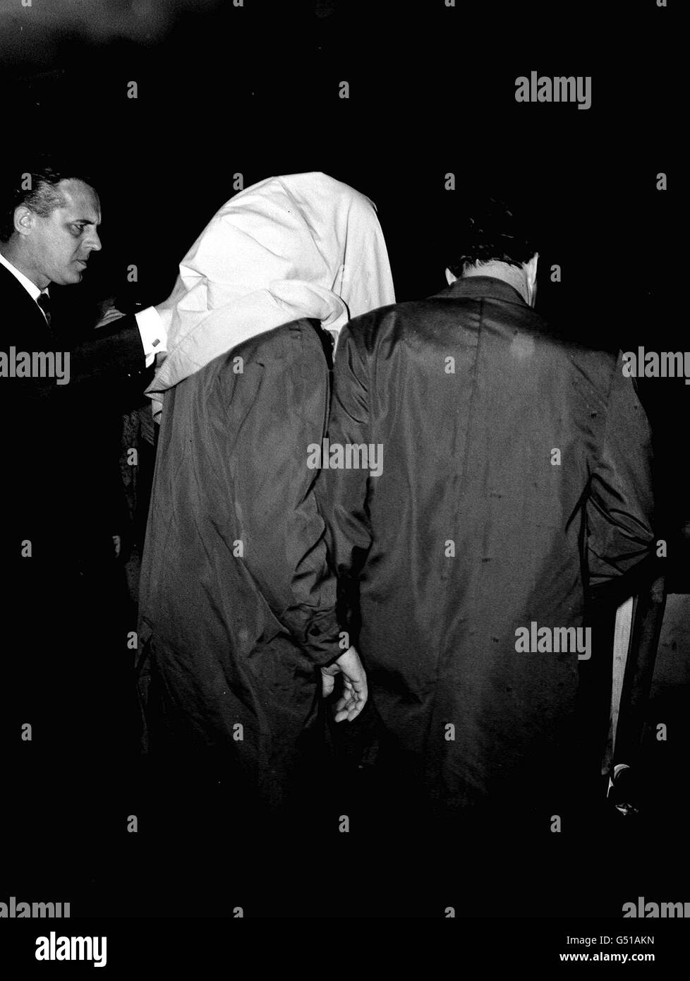 Ronald James Everett with his head covered, as he was brought back from Australia at Heathrow Ronald James Everett with his head covered, as he was brought back from Australia at Heathrow