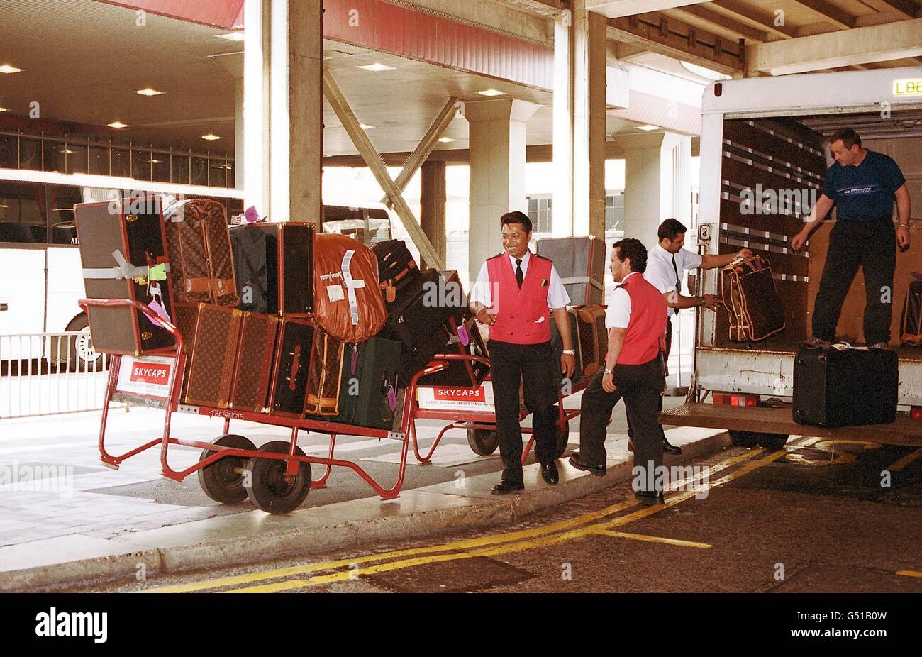 Hollywood actress Elizabeth Taylor's luggage being transferred from Heathrow Airport, after her arrival from Los Angeles, where she is preparing to be made a Dame by the Queen. The 68 year old British-born actress said 'It's the peak of my life'. * The eight-times married star who wed Welsh-born actor Richard Burton twice vowed she would never tie the knot again when asked if there was currently a man in her life. 24/10/04: Overpacking British holidaymakers are taking bags too much luggage away with them. Most lumber themselves with 15 kilos of hand luggage - 50% more than the Stock Photo