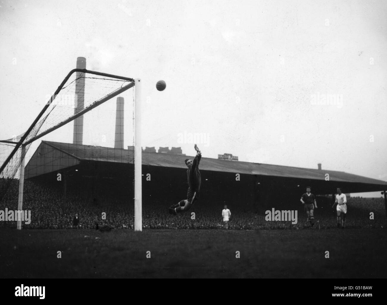 Ray Wood (Manchester United goalkeeper) tips a shot from Alfredo Di