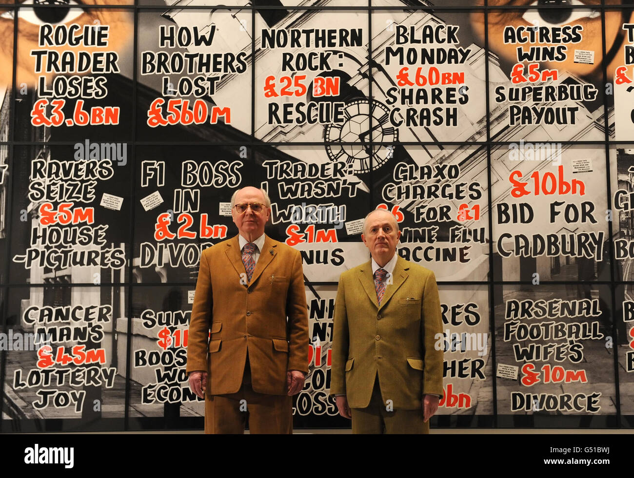 Artists Gilbert Proesch (right) and George Passmore (left) with artworks from their 'London Pictures' series, at White Cube gallery, in Bermondsey, London. Stock Photo