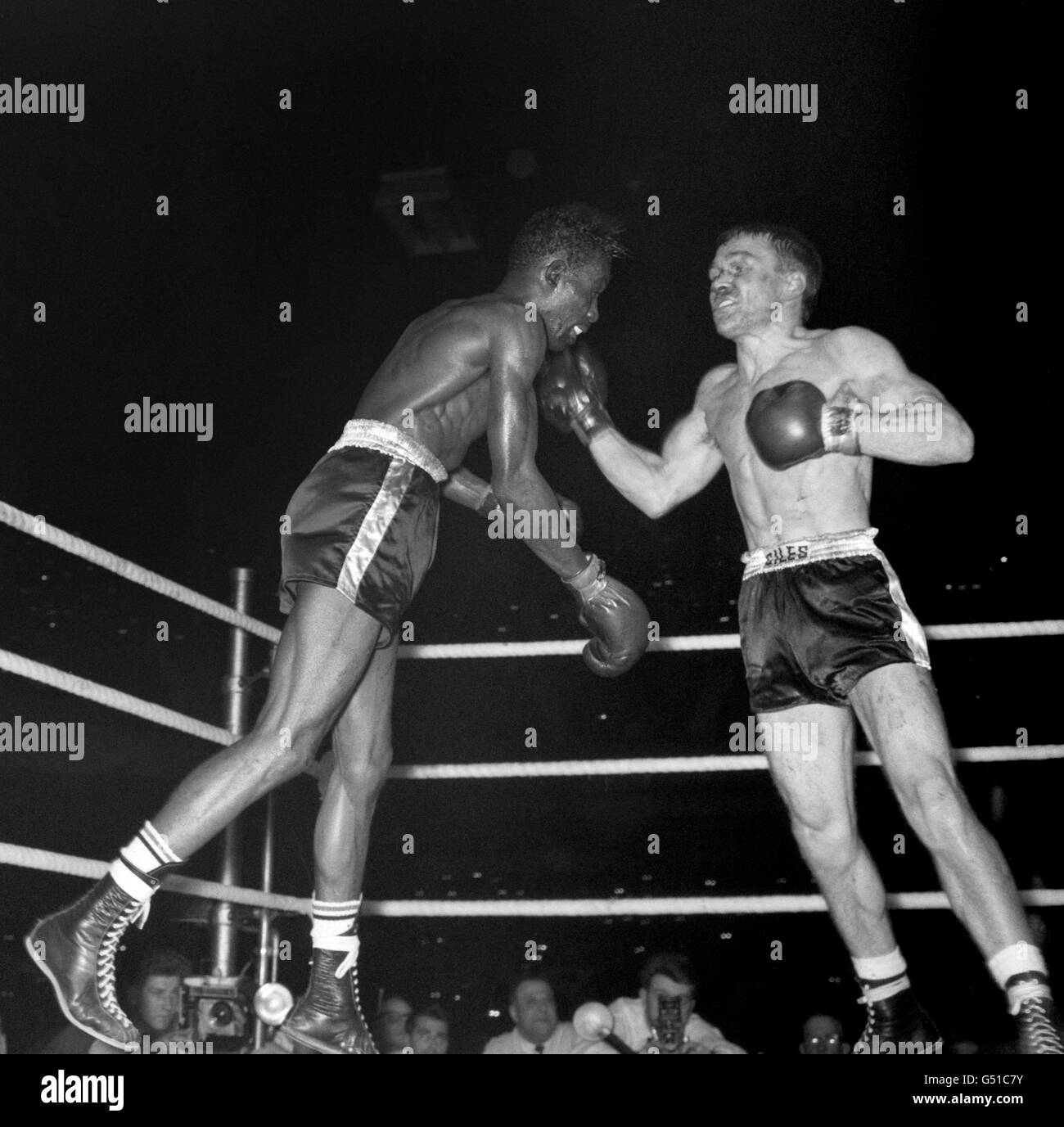 British challenger Dave Charnley (r) catches American Joe Brown on the chin during the fight. Joe Brown went on to win on points after 15 rounds. The fight was voted 1961 Ring Magazine Fight of the Year. Stock Photo