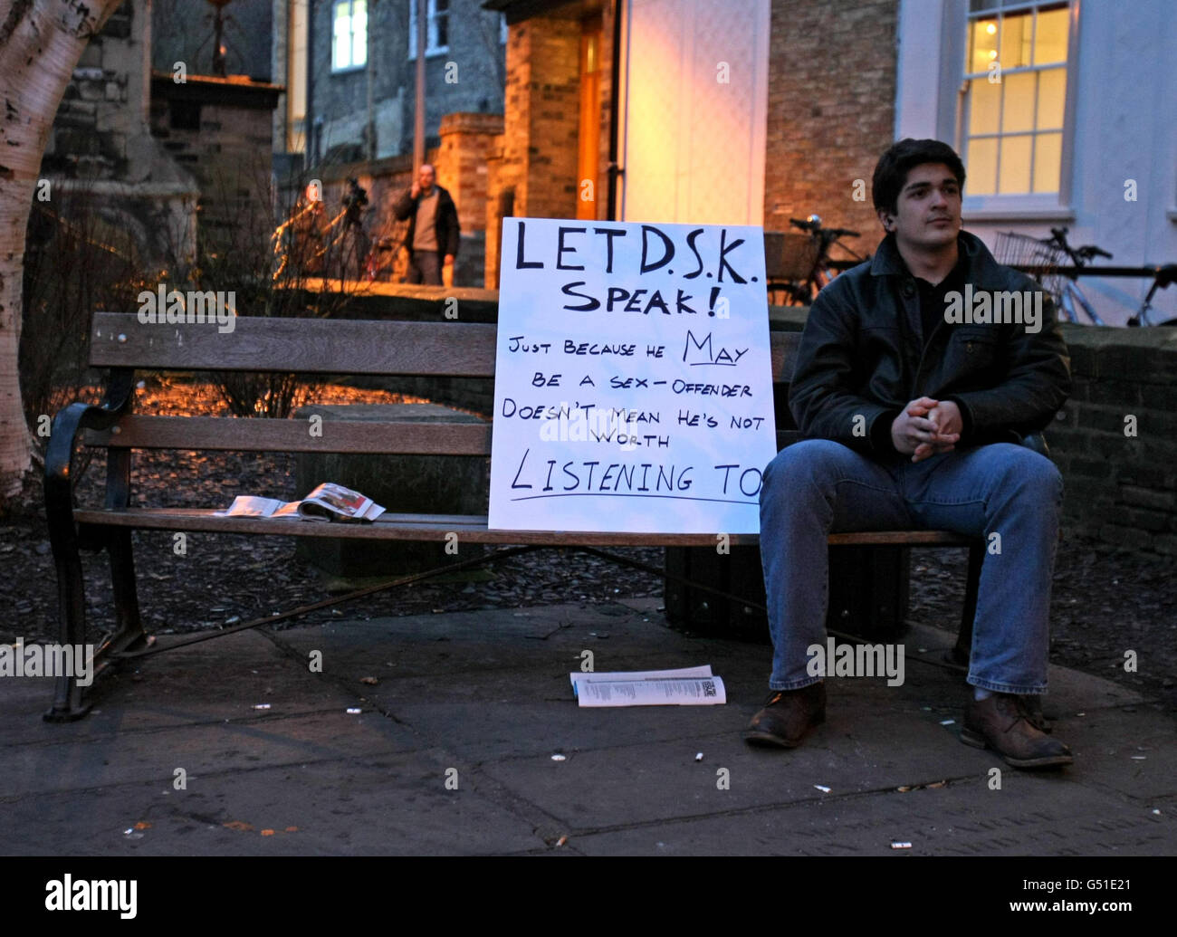 A protesters with a sign in support of The Cambridge Union's guest speaker, former head of the International Monetary Fund Dominique Strauss-Khan. Stock Photo