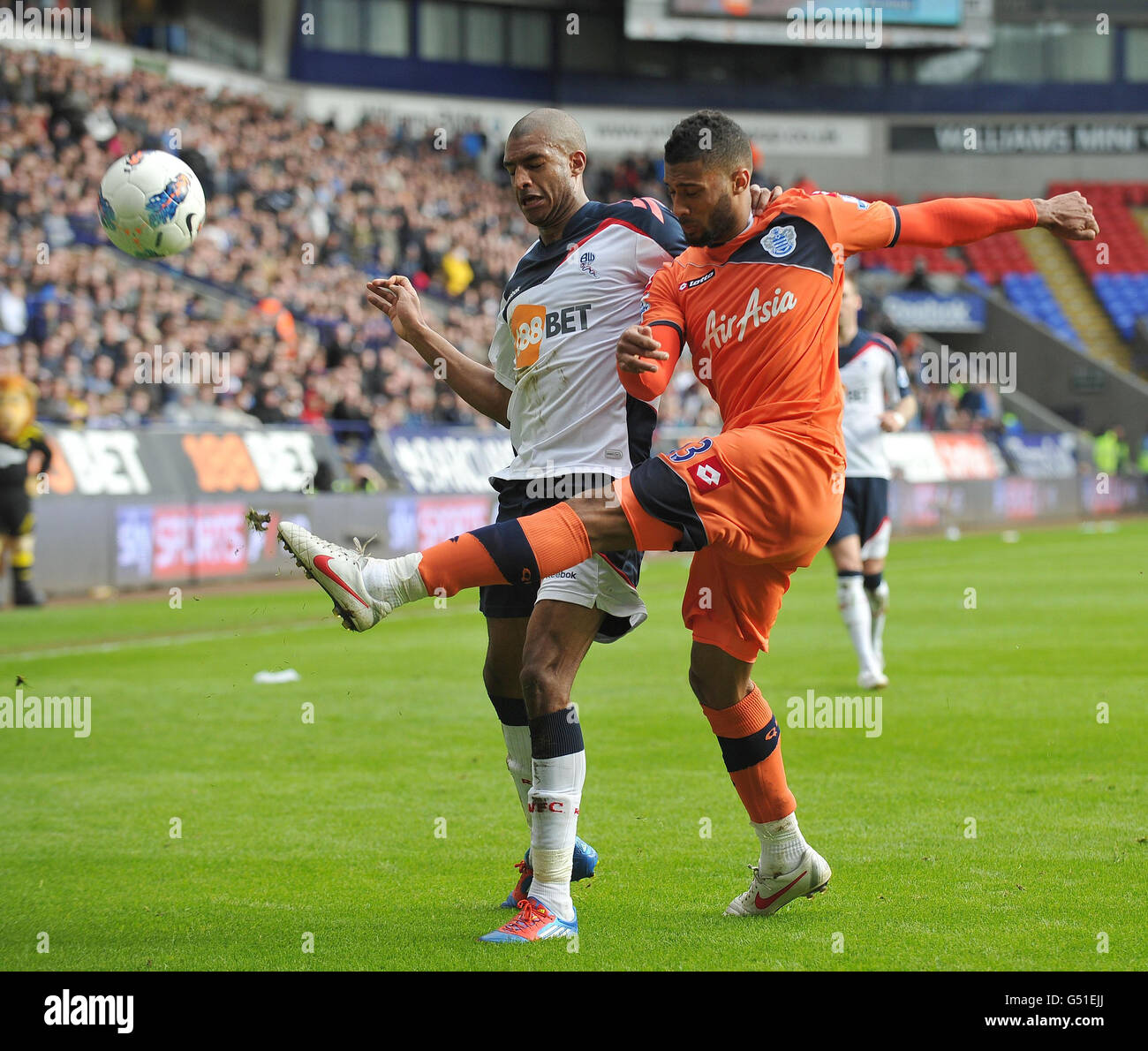 Bolton's David Ngog and QPR's Armand Triore in action during the Barclays Premier League match at the Reebok Stadium, Bolton. Stock Photo