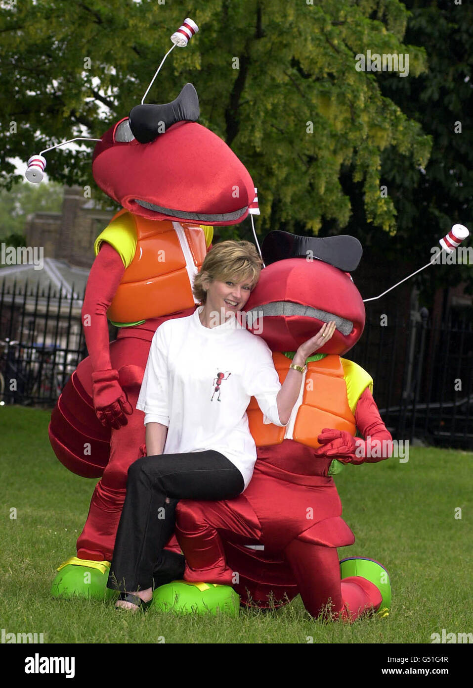 TV Presenter Anthea Turner with a pair of cartoon ants from the on-line shopping service www.LetsBuyIt.com, at the Chelsea Flower Show in London. Stock Photo