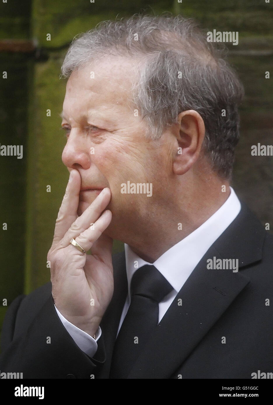 Father McBride following the funeral of his son Paul McBride QC