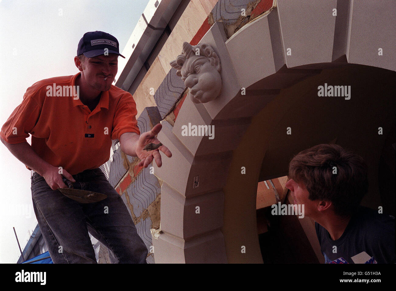 Workmen building plastering wall hi-res stock photography and images ...