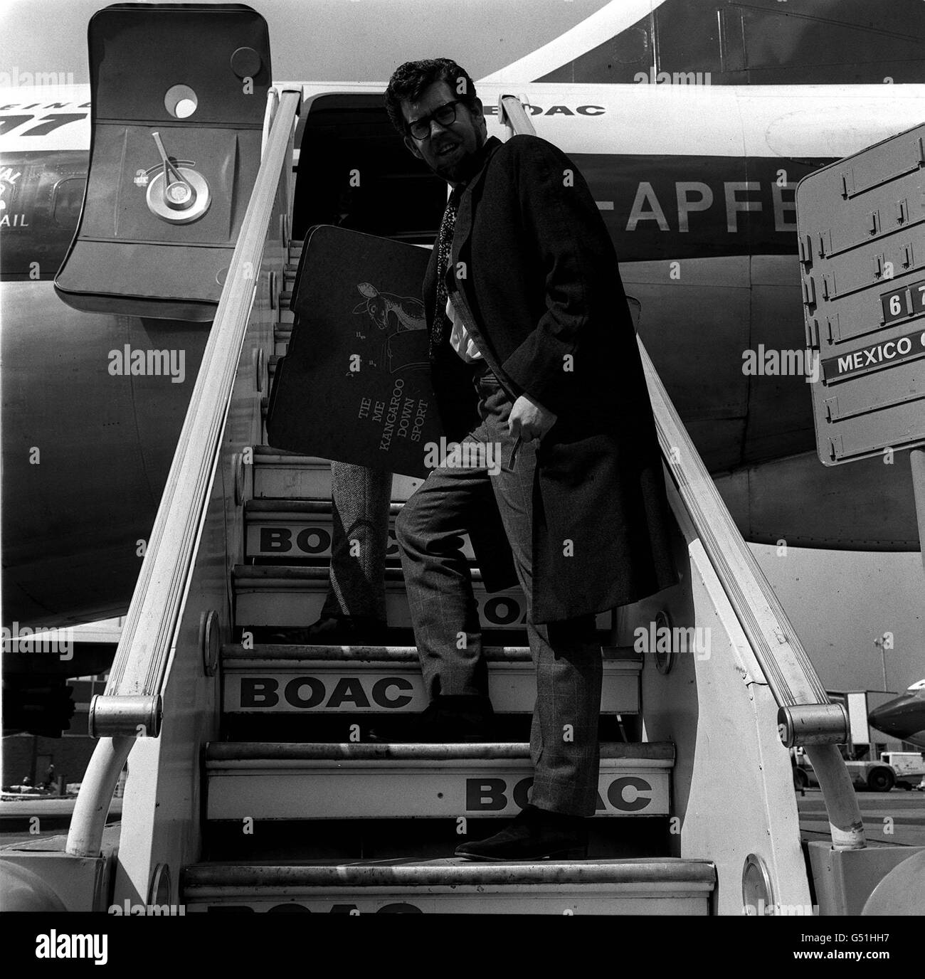 Three legged Rolf Harris, the Australian entertainer, leaving for Bermuda from Heathrow Airport. Stock Photo