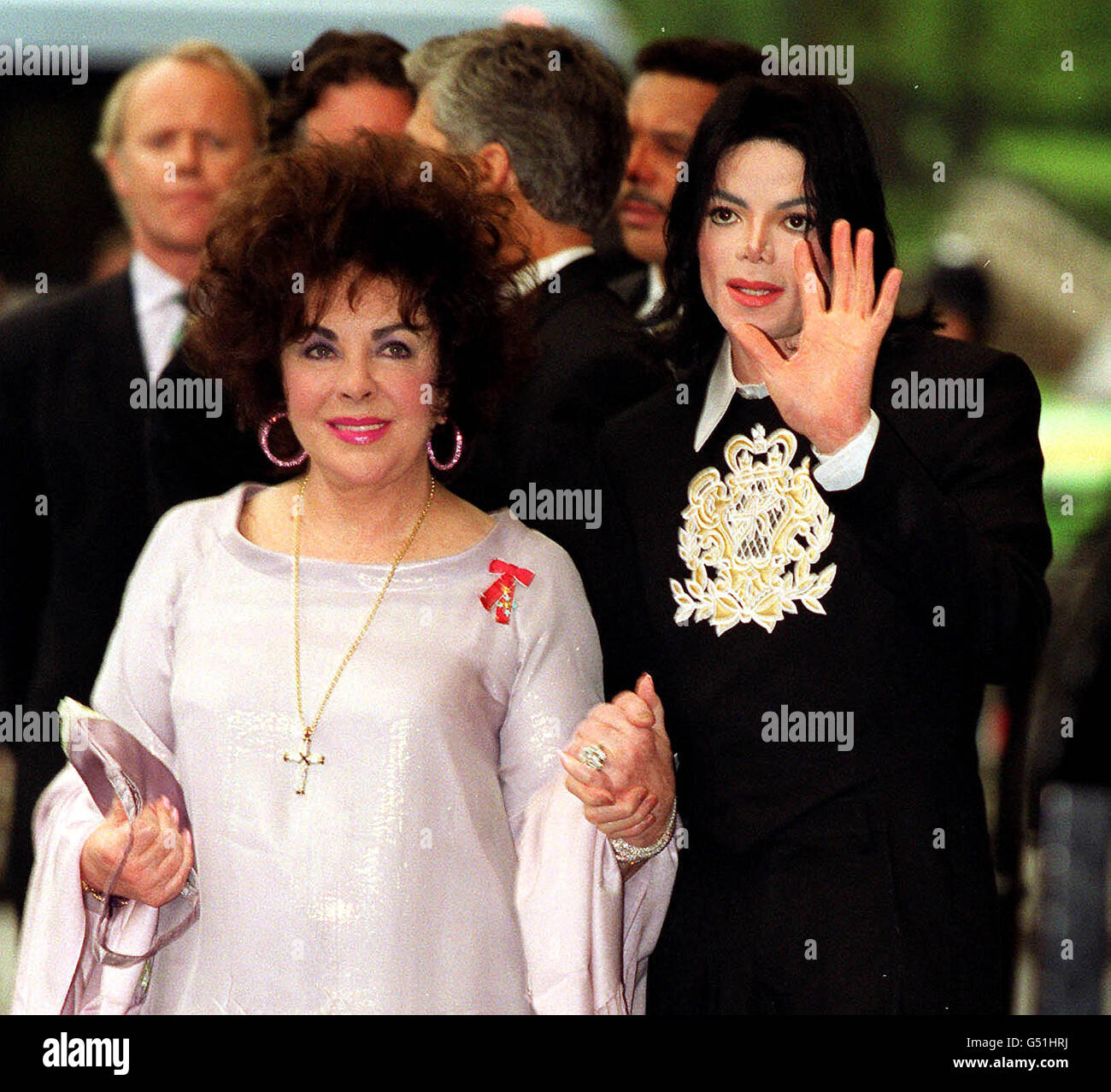 Dame Elizabeth Taylor, accompanied by American pop singer Michael Jackson, attend a gala charity concert honouring the career, life and fundraising achievement of Ms Taylor, at the Royal Albert Hall in London. * 8/1/2001: US singer Michael Jackson who is to record and tour again this year with a reunited Jackson 5, his brother Jermaine has claimed in a radio interview it was reported. Jermaine told Sirius Satellite Radio in Las Vegas that the legendary soul group would play together for the first time since 1984. Stock Photo