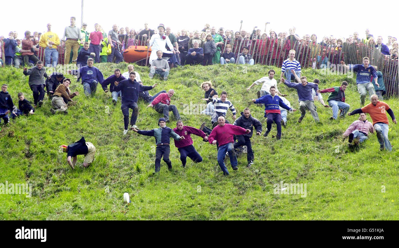 Cheese rolling contest hill chase Stock Photo - Alamy