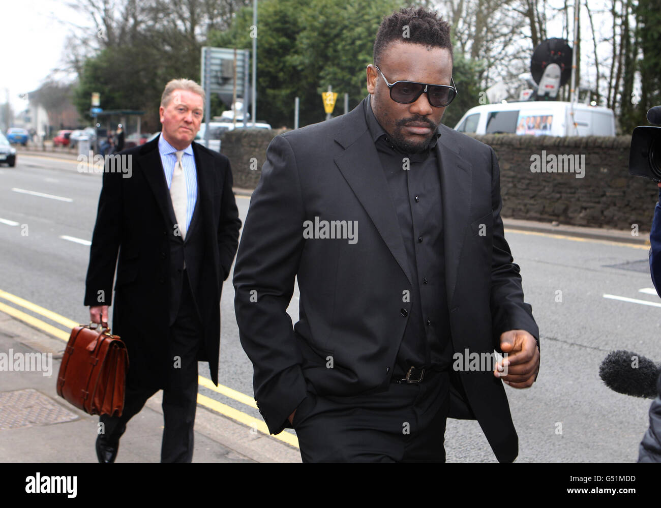 Dereck Chisora arrive at British Boxing Board of Control hearing in Cardiff with Promotor Frank Warren (left) at the British Boxing Board of Control, Cardiff. Stock Photo