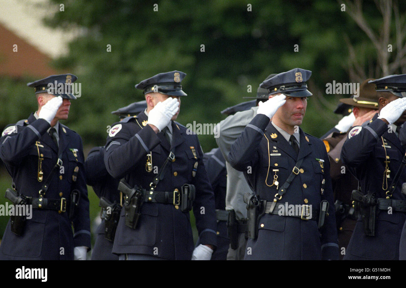 police salute at funeral for officer killed in the line of duty