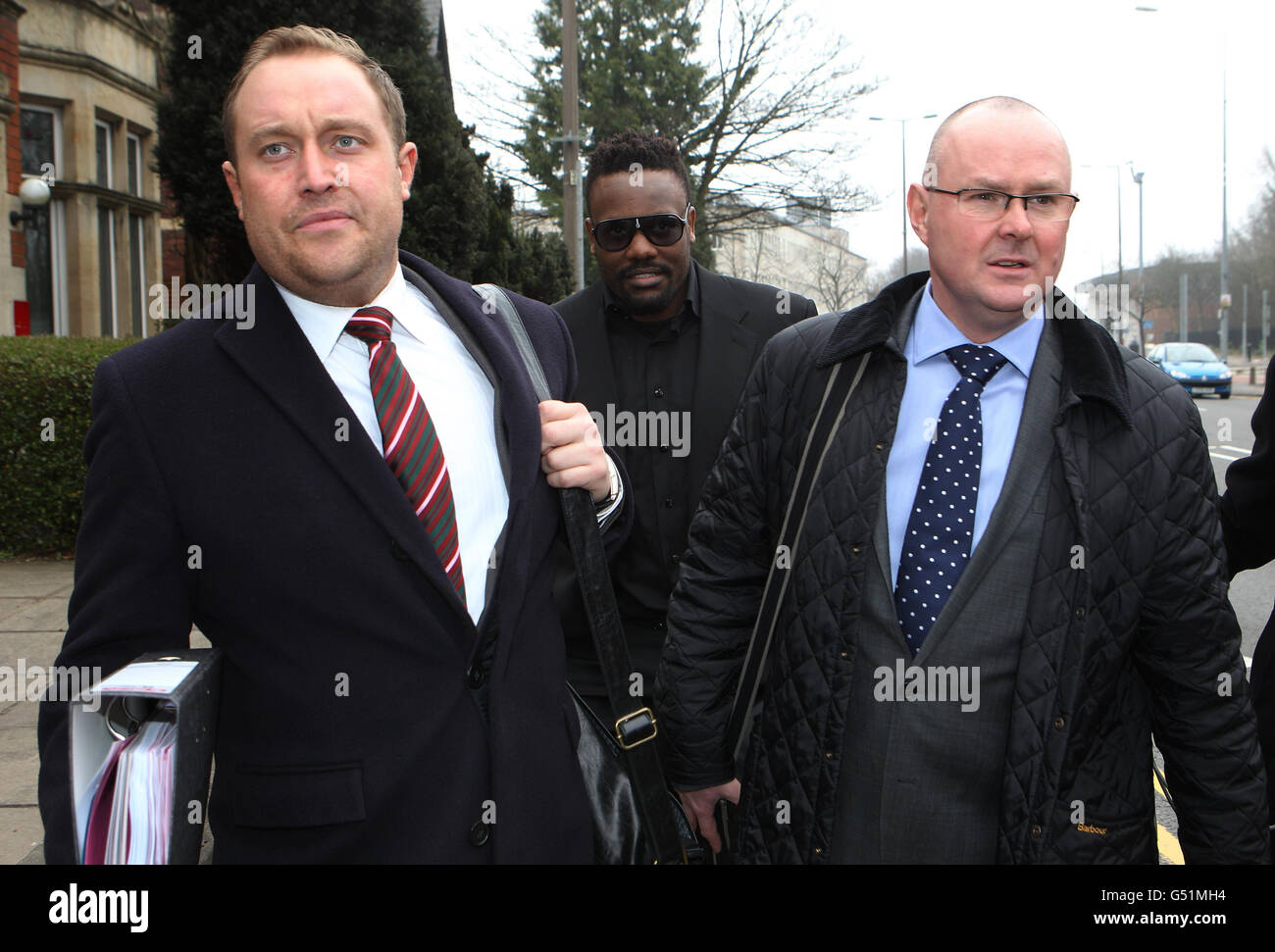 Dereck Chisora arrives at British Boxing Board of Control hearing in Cardiff with Promotor Francis Warren (left) and Andy Ayling both of Frank Warren Promotions at the British Boxing Board of Control, Cardiff. Stock Photo
