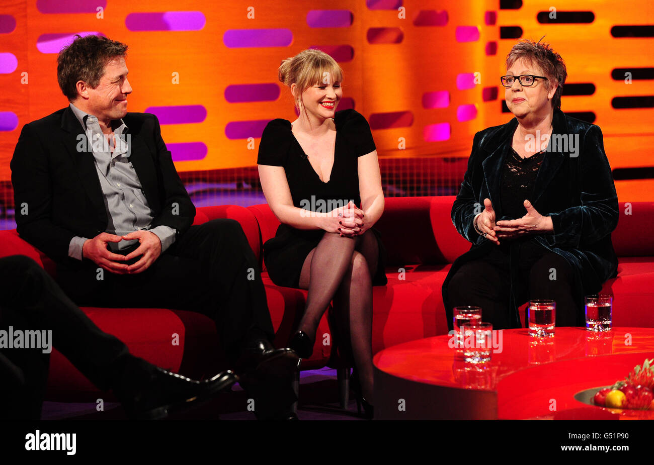(Left - right) Hugh Grant, Joanna Page and Jo Brand during the filming of the Graham Norton Show at The London Studios, south London, to be aired on BBC One on Friday evening. PRESS ASSOCIATION Photo. Picture date: Thursday March 15, 2012. Photo credit should read: Ian West/PA Wire Stock Photo