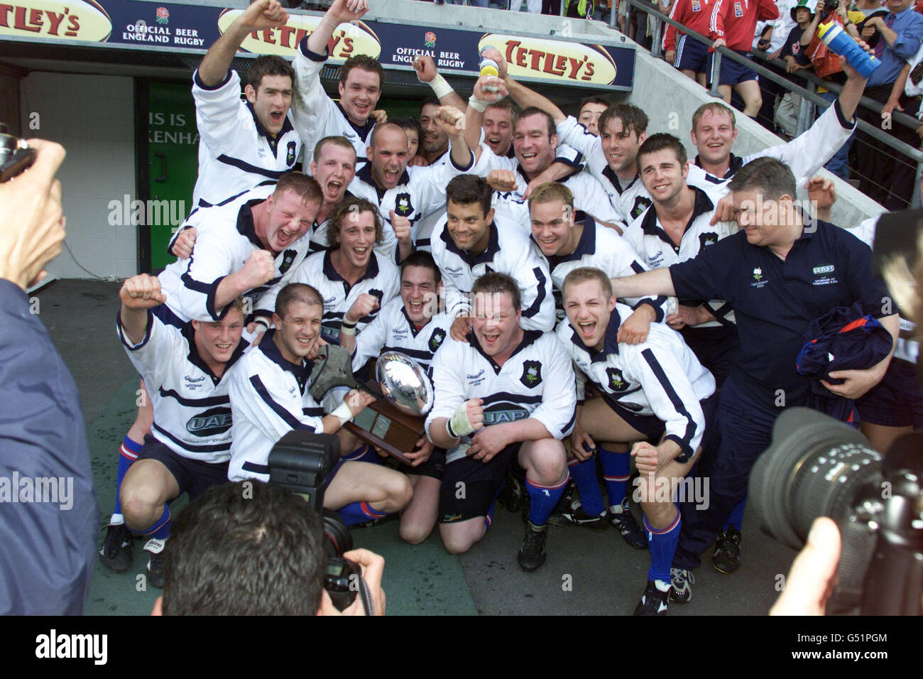 The Yorkshire team celebrate with the winner's trophy after they beat