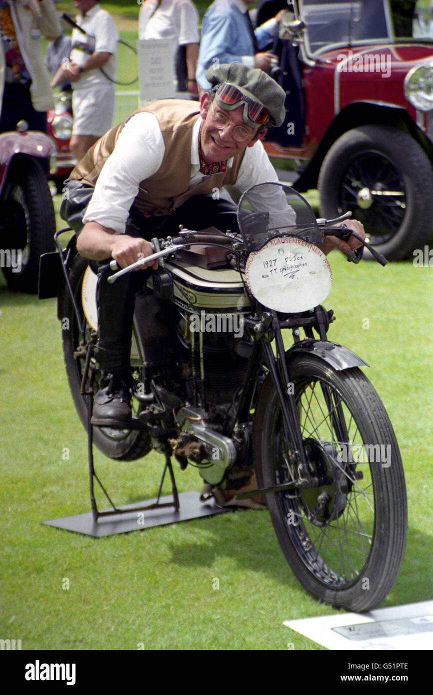 Dr Geo Cohen sat astride his 1927 Norton TT replica motorcycle at the Louis Vuitton Classic, a classic car and motorbike event held at the Hurlingham Club in London. Stock Photo