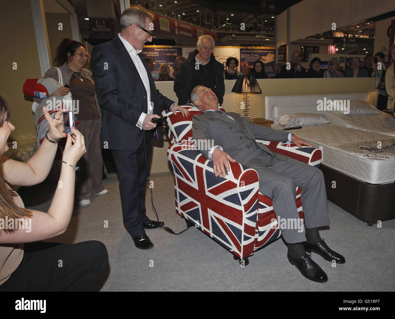 The prince wales tries armchair visit ideal home show hires stock