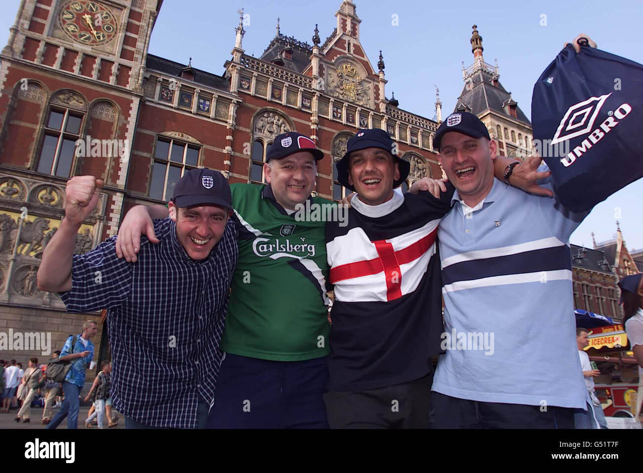 England soccer fans arrive at Amsterdam's Central Rail Station for a weekend of partying in the famous Dutch city to mark the start of the Euro 2000 football Championships. England's opening game is against Portugal in Eindhoven. * Left to right: Stuart Deans, Kevin Donovan, Stewart Dalziel, and Phil Jones, all from Cleethorpes, and are members of the supporter's club, managing to secure tickets for all the games right up to the final. Stock Photo