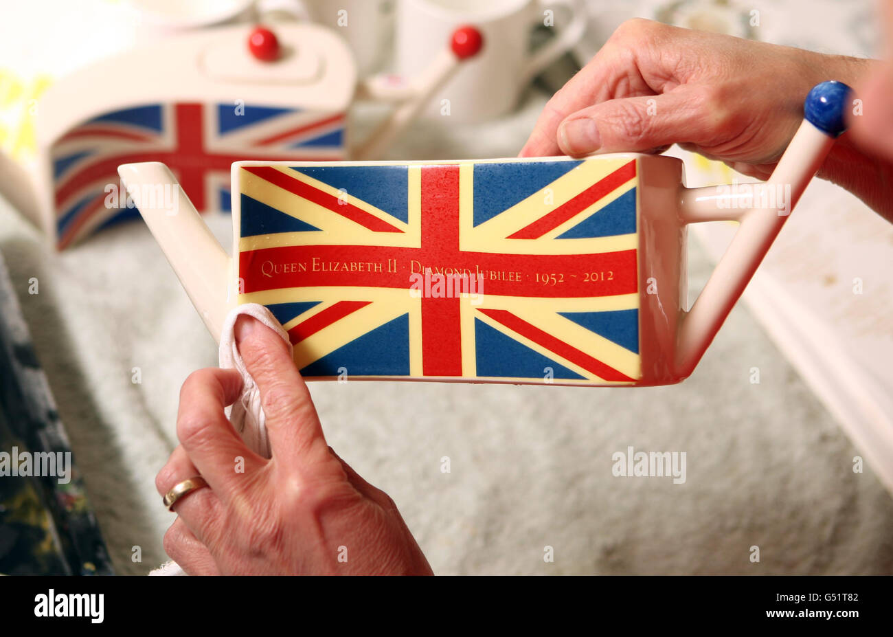 Carol Bridges completes a teapot celebrating the Queen's Diamond