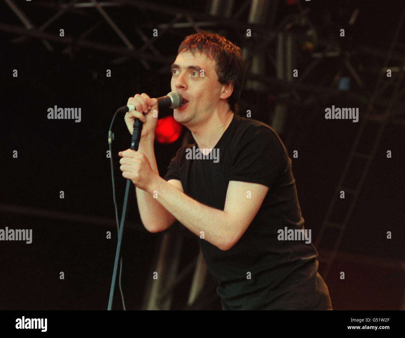 Singer Paul McCloone, of the Irish pop-punk band The Undertones, performing on stage at The Fleadh music festival in Finsbury Park, central London, on Saturday 10 June 2000. Stock Photo