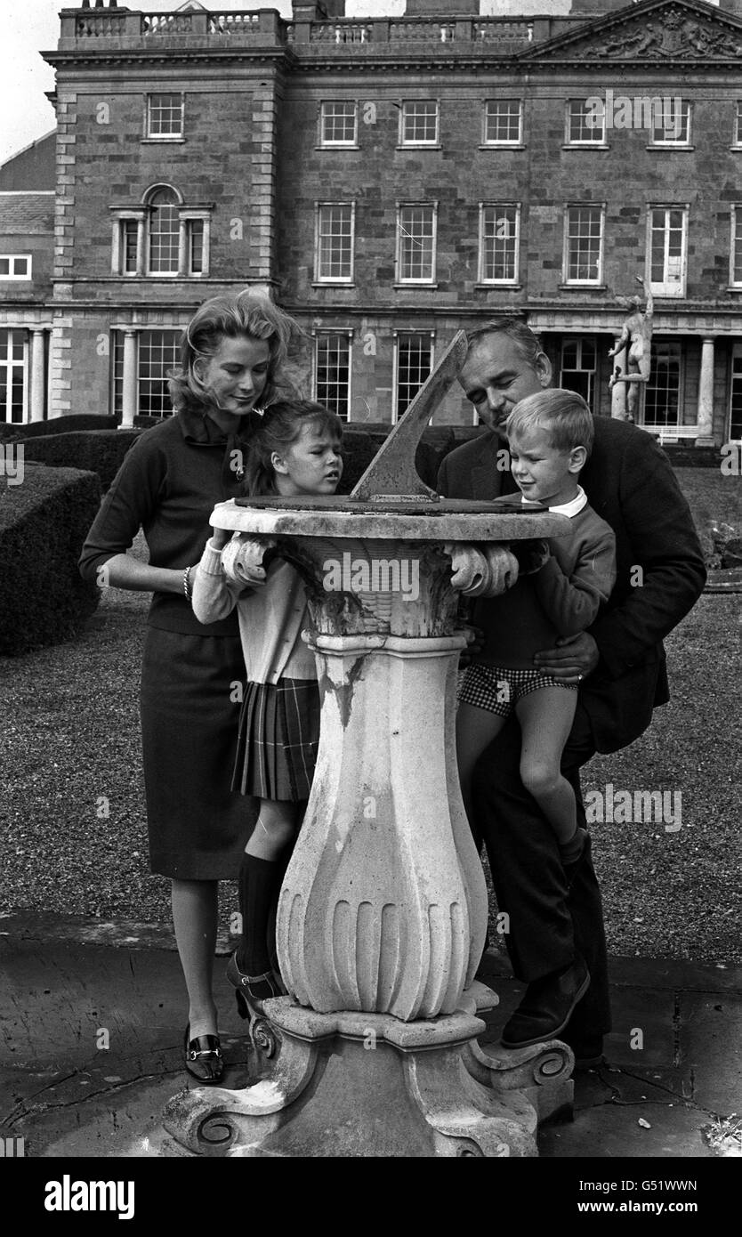 GRIMALDIS IN IRELAND: Prince Rainier and Princess Grace of Monaco show their children, Princess Caroline and Prince Albert, a sundial in the grounds of Carton House, Co. Kildare, the Irish home of Lord Brocket, during a holiday in Ireland. Stock Photo