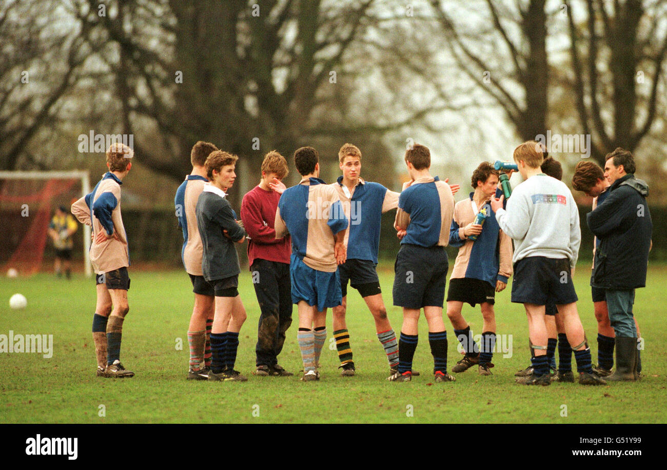 Prince William is seen captaining his side (Gailey's) in his house colours of fawn and blue in the semi-final of an inter-house tournament between Gailey's and Hurst's. * Gailey's lost the game 2-1. Eton plays soccer and its own related game - the 'Field Game' - a mix between rugby and soccer which uses small hockey-sized goals. Prince William played for the 3rd Field winning his colours. He also played rugby for his school throughout his junior years and played for the School 2nd XV until a hand injury stopped him playing. Photograph: Ian Jones. Copyright: St James's Palace. Stock Photo