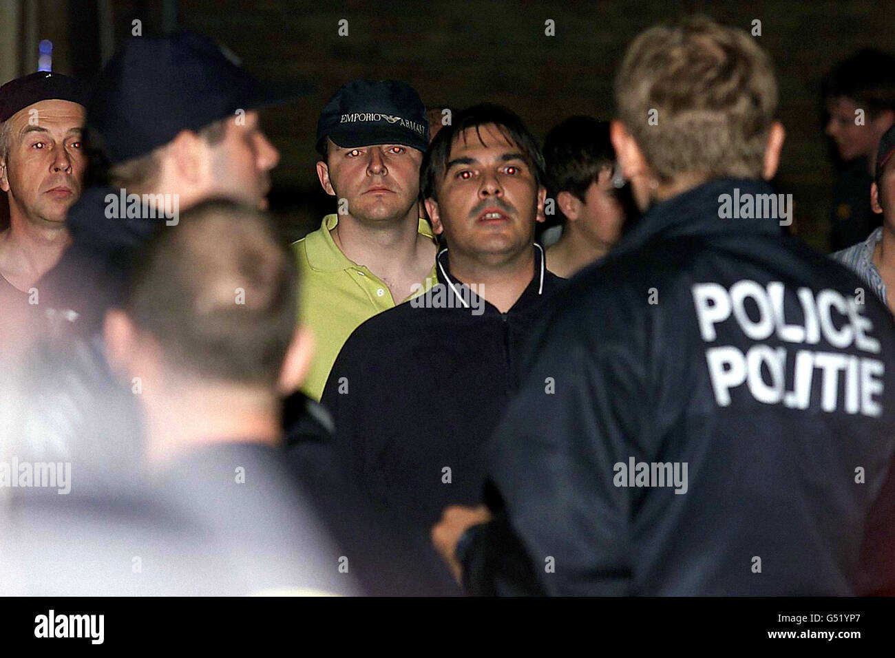 English soccer fans pictured inside a Brussels police station after