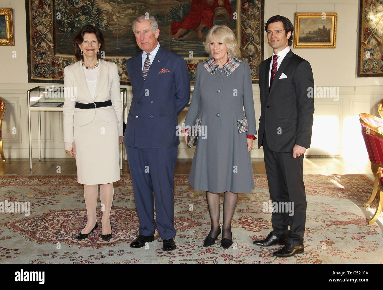 (left - right) Queen Silvia of Sweden, The Prince of Wales, The Duchess of Cornwall and Prince Carl Philip of Sweden pose for an official photo in the Royal Palace in Stockholm, Sweden. Stock Photo