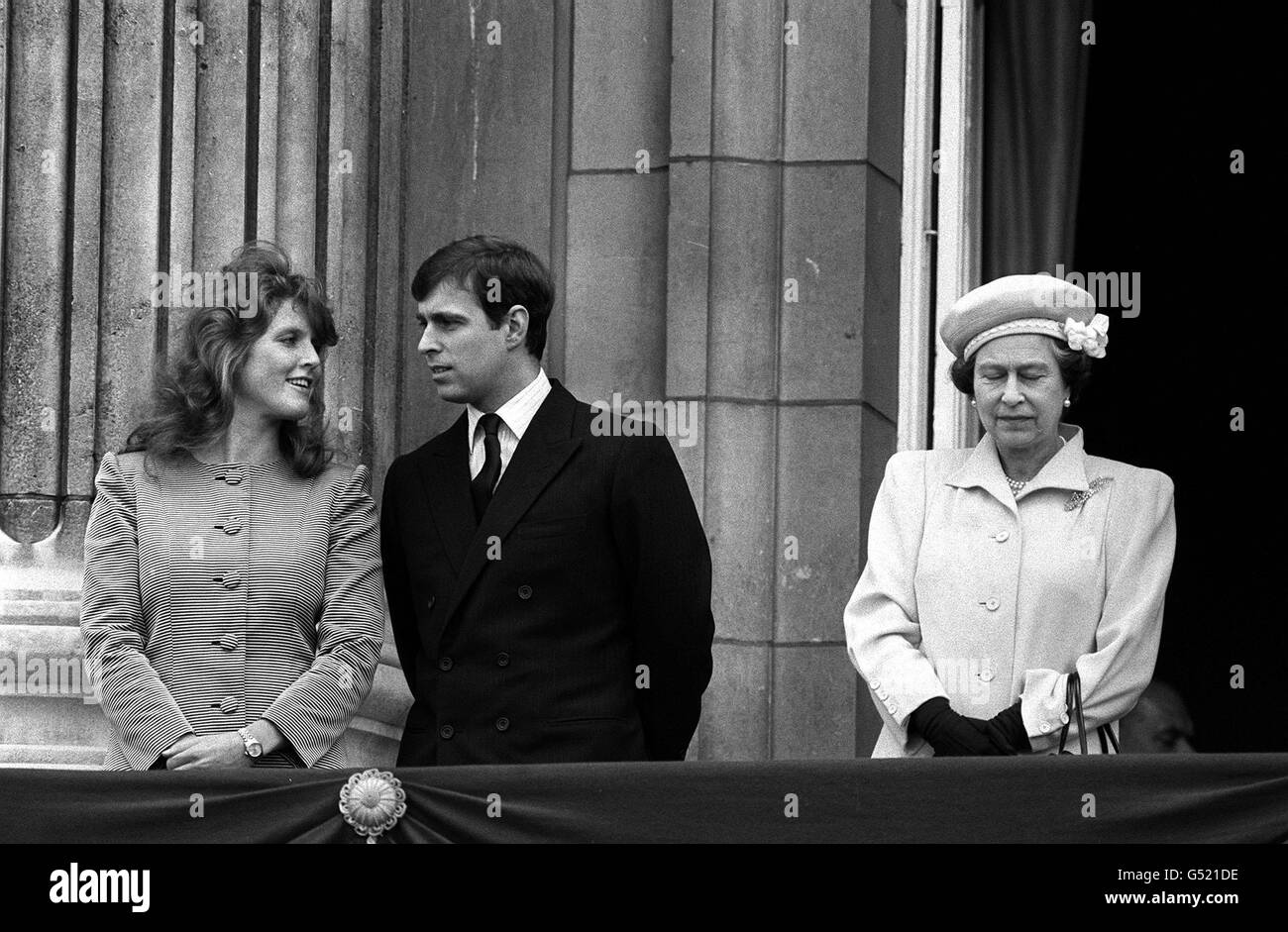 SARAH FERGUSON 1986: Prince Andrew (later the Duke of York) with his fiancee, Sarah Ferguson (later the Duchess of York) and his mother, the Queen, on the balcony of Buckingham Palace on the day of the Queen's 60th birthday. *The young couple listened to thousands of children singing to Her Majesty. Stock Photo