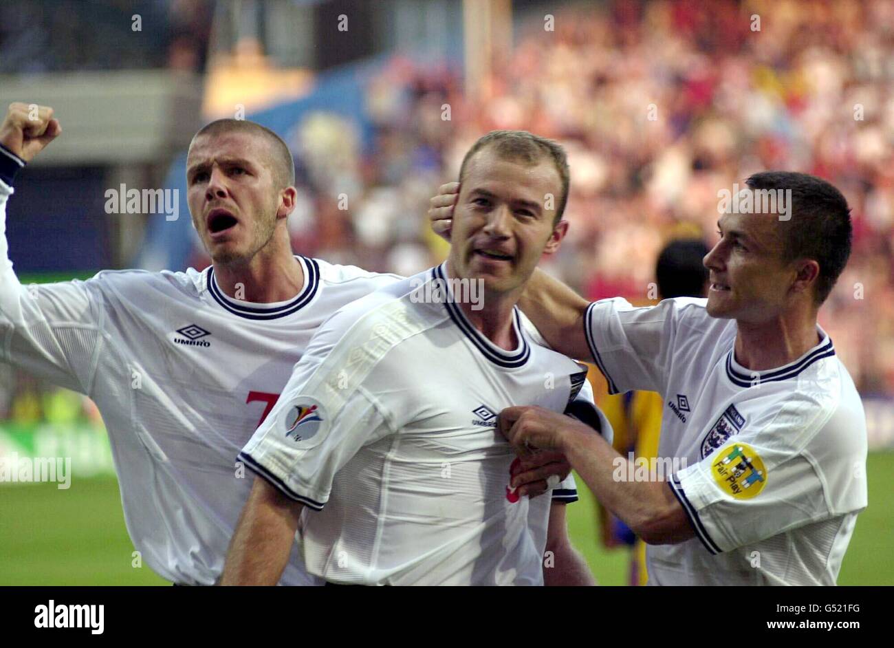 England captain Alan Shearer (C) is congratulated by teammates David Beckham (L) and Dennis Wise after scoring from the penalty spot during the Euro 2000 game against Romania in Charleroi. Stock Photo